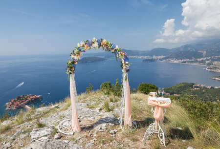 wedding arch on a hill overlooking the seaの写真素材
