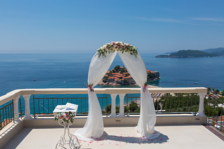 Beautiful wedding arch on the terrace overlooking the seaの写真素材
