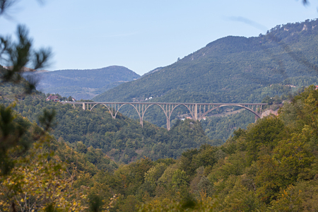 Durdevica arched Tara Bridge over green Tara Canyon - Montenegro.の写真素材