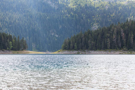Beautiful mystical lake. Black Lake, Durmitor National Park. Montenegroの写真素材