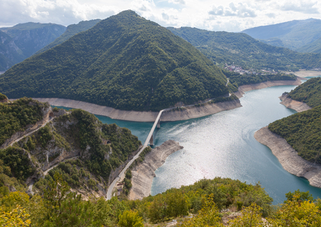 Blue water of Piva lake in Montenegroの写真素材