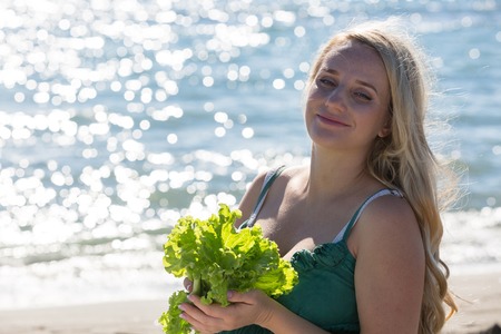 mother and daughter at a picnic on the beachの写真素材