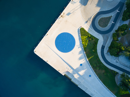 Aerial view of a square with a Greeting to the Sun the 22 m diameter circle which contains 300 multilayer glass panels with solar cells and light-emitting diodes.の写真素材