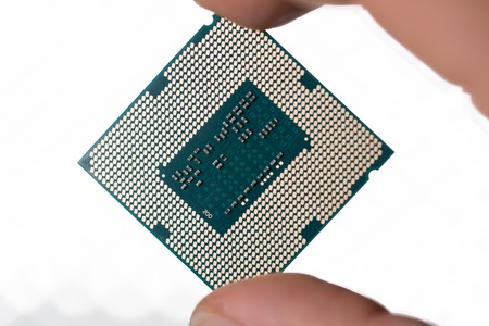 modern computer processor in hand, close up