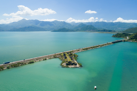 Aerial view of Skadar lake, dam and island with old medieval fortress Lesendro, Montenegroの写真素材