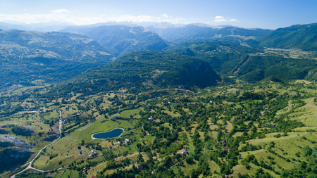 Aerial view Komarnica river canyon and the road to Zabljakの写真素材