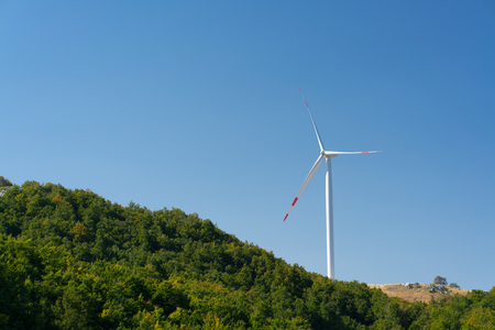 Windmills converting wind energy into electricityの写真素材