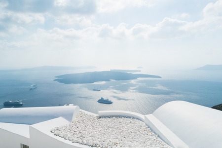 view of the island volcano Nea Kameni from the village of Imerovigliの写真素材