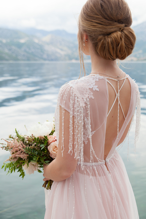 wedding bouquet with white peony and rosesの写真素材