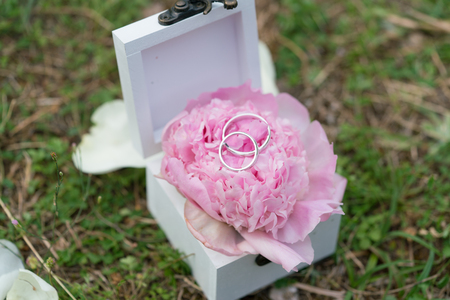 casket for wedding rings with fresh flower for ceremonyの写真素材