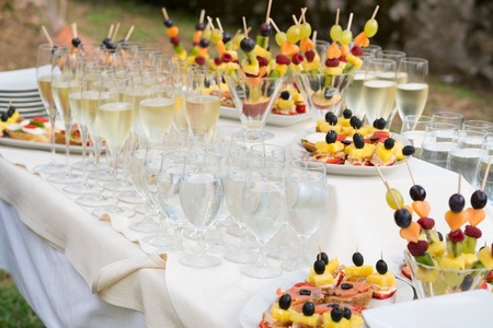champagne glasses and various snacks for consumption after the wedding ceremonyの写真素材