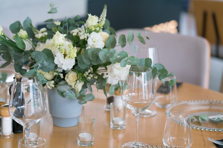 tables served for a wedding dinner in a restaurantの写真素材