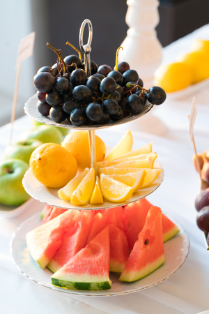 Banquet table full of fruits and berriesの写真素材