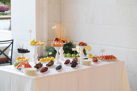 Banquet table full of fruits and berriesの写真素材