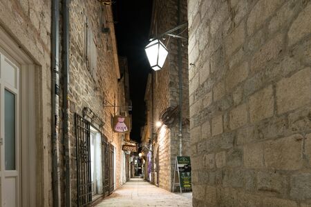 Budva, Montenegro - December 16, 2019: old town street at nightのeditorial素材