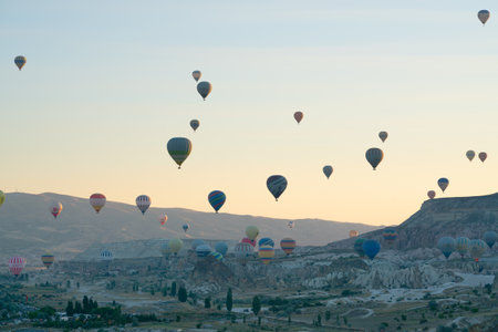 Goreme, Turkey, July 18, 2023: A balloons flies over Cappadociaのeditorial素材