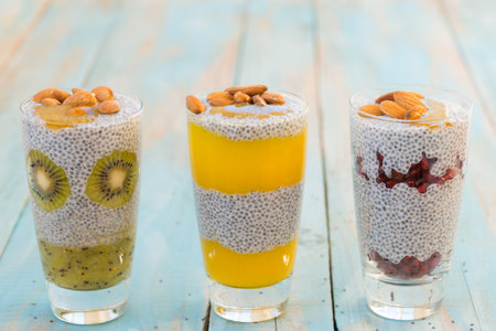various puddings with chia kiwi pomegranate and mangoの写真素材