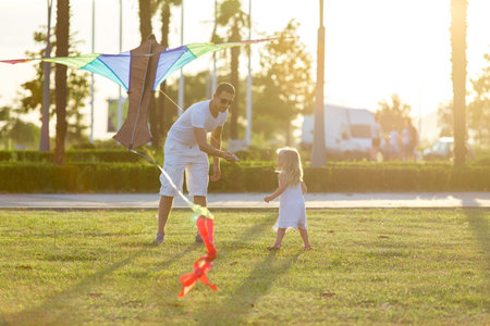 little girl flying a kiteの写真素材