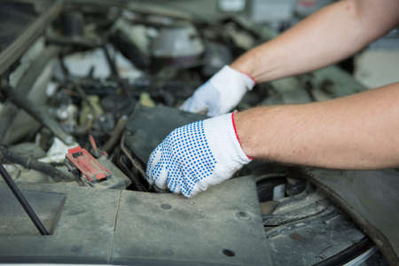 People are repair a car Use a wrench and a screwdriver to work.Safe and confident in driving....