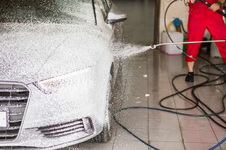 Manual car wash with pressurized water in car wash outside Application of special foamの写真素材