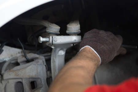 People are repair a car Use a wrench and a screwdriver to work.Safe and confident in driving....