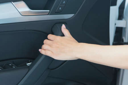 Beautiful successful girl sitting in the car Beautiful red sports carの写真素材