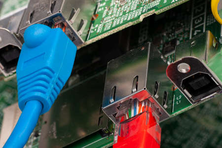 Network switch and ethernet cables, close up macro shot on computer circuit board Network cables...