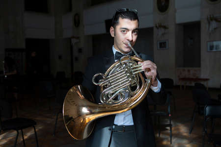 French horn player. Hornist playing brass orchestra music Close-upの写真素材