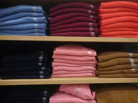 Men's shirts on store shelves Close-up