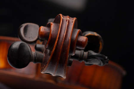 Violin close up isolated on black background Limited depth of fieldの写真素材