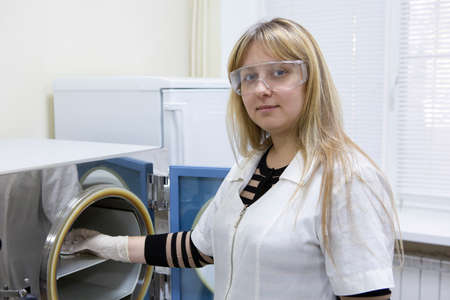 Female Laboratory Scientist Examining Sample In Test Tube Close-up