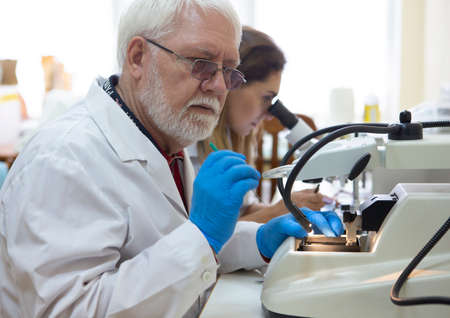 Health care researchers working in life science laboratory. Young female research scientist and...