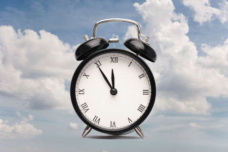 Clock against a cloudy sky Collage Card Close-upの写真素材