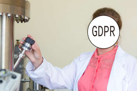 GDPR - a young woman doing research in a modern laboratory, her face is hidden inscription General...