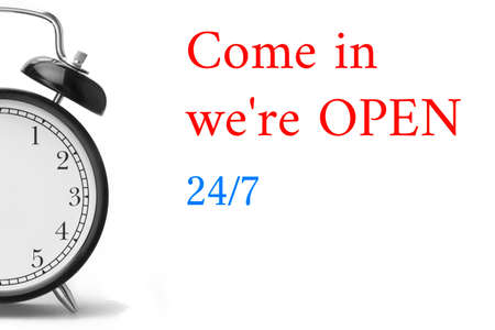 Come in we're OPEN sign in red and white, on shop door Close-up