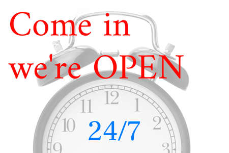 Come in we're OPEN sign in red and white, on shop door Close-up