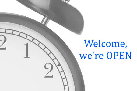 Welcome we're OPEN sign in blue and white, on shop door Close-up
