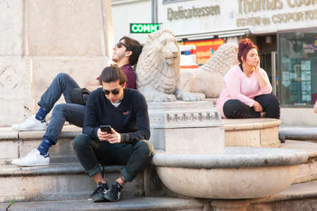 Budapest, Hungary - April 10, 2018: Young people relaxing on the city street Genreのeditorial素材