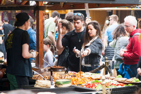 Budapest, Hungary - April 5, 2018: Young couple buying traditional street food Genreのeditorial素材