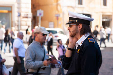Rome, Italy, October 14, 2011: the policeman helps the tourist Genre