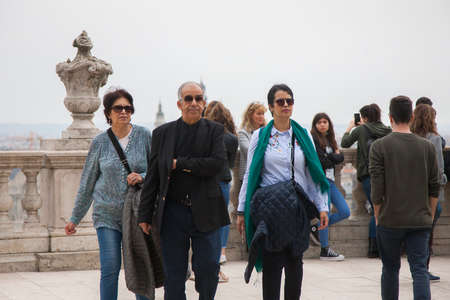 Budapest, Hungary - April 10, 2018: The aged husband with his wife and daughter Genre portrait