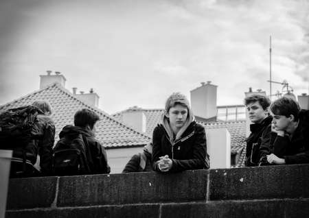 Prague, Czech Republic - March 14, 2017: Group of students on a tour of Charles Bridge Genre Black and white imageのeditorial素材