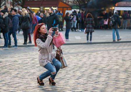 Prague, Czech Republic - March 15, 2017: Tourists taking pictures of the famous medieval astronomical clock in Prague Genreのeditorial素材