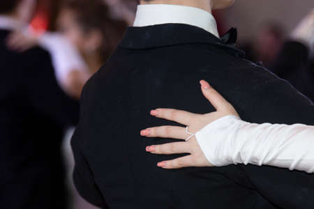 Wedding theme, holding hands newlyweds White gloves Close-upの写真素材