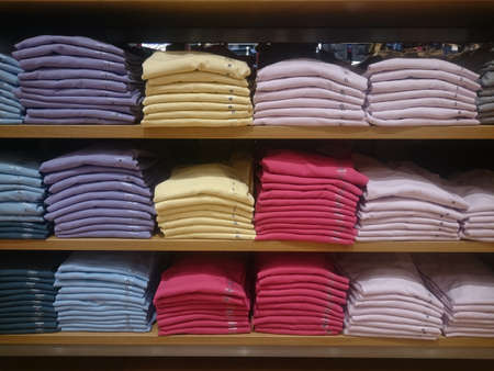 Men's multi-colored knitted shirts on store shelves Close-upの写真素材