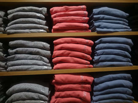 Men's multi-colored knitted shirts on store shelves Close-upの写真素材