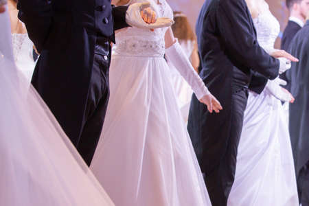 Wedding theme, holding hands newlyweds White gloves Close-upの写真素材