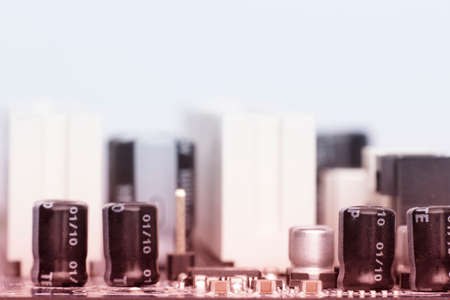 Electronic components are mounted on the device board Chips diodes capacitors chokes Toned imageの写真素材