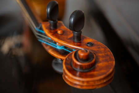 violin in vintage style on wood background close up, classical music concertの写真素材