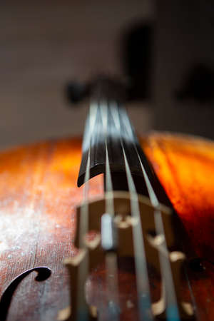 violin in vintage style on wood background close up, classical music concertの写真素材